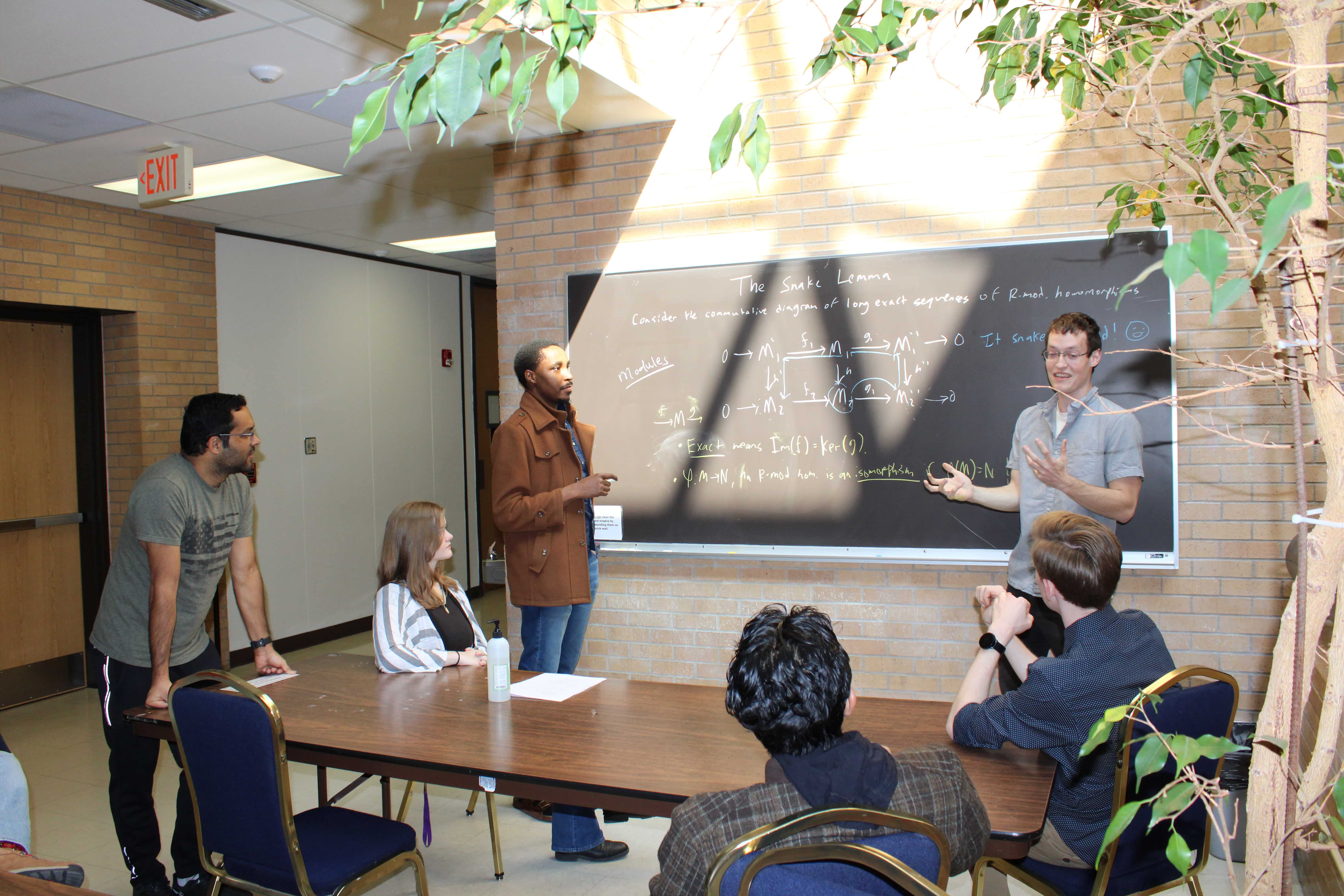 Graduate students working in the atrium